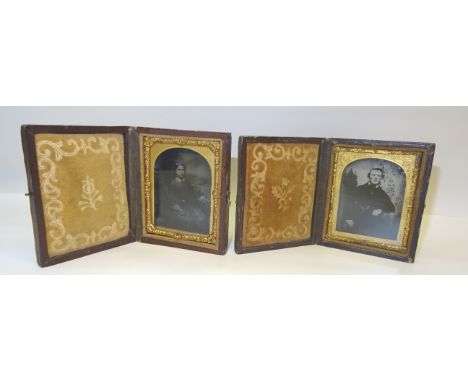 A pair of Victorian portrait Photographs of a lady and gentleman in folding leather frames.
