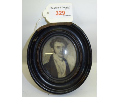 A 19th Century miniature oval Portrait on ivory of the head and shoulders of a young man with inscription to the reverse and 