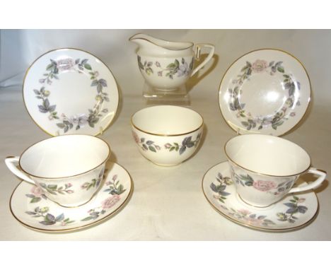 A Royal Worcester June Garland pattern Tea set comprising eight cups, nine saucers, eight plates, milk jug and sugar bowl. 