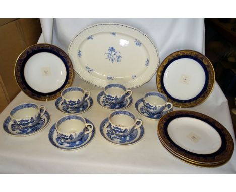 Five Wedgwood Plates decorated with a blue and gilt border pattern, a number of Wedgwood willow pattern cups and saucers and 