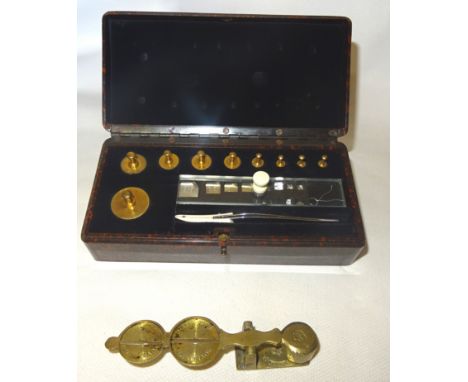 A set of Jewellers Weights by Baird & Tatlock, Hatton Garden, London in a Bakelite case and a set of brass sovereign and half