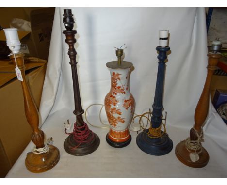 A mahogany fluted column Candlestick Table Lamp, 21" (53cms) high, another, a pair of similar lamps and a vase column table l