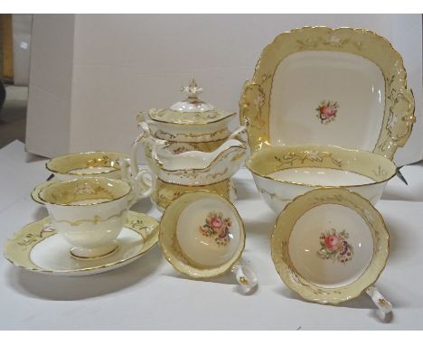 A Victorian Tea Set decorated with floral sprays within a cream and gilt border, comprising six coffee cups, five tea cups, f