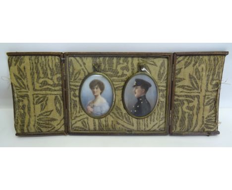 A pair miniature oval head and shoulders Portrait Photographs of a Military officer and his wife with some over painting and 