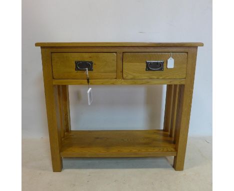 A contemporary light oak side table with 2 drawers, H.77 W.85 D.35cm 