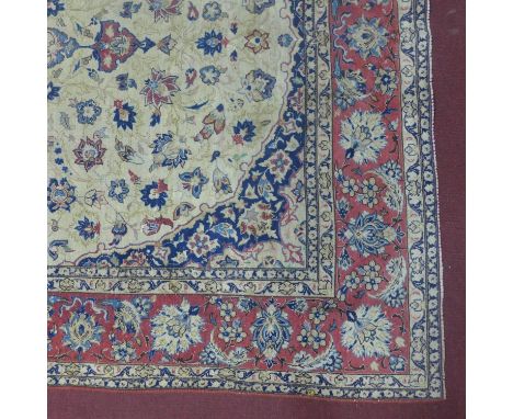 A 20th century Tabriz carpet with floral medallion, on a beige ground, contained by floral border, 316 x198cm 