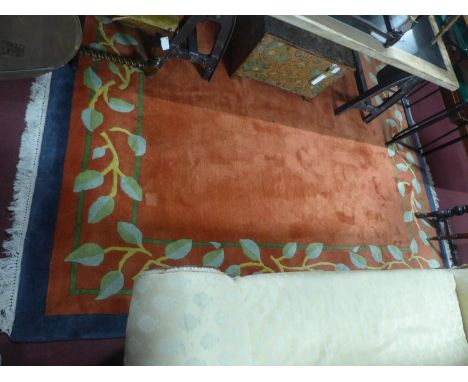A large red ground woolen carpet with leaf border, 290 x 254cm 