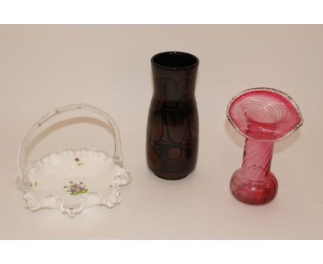 A Poole pottery baluster vase; a Fenton coloured glass posy basket; and a cranberry glass Jack In The Pulpit style vase 