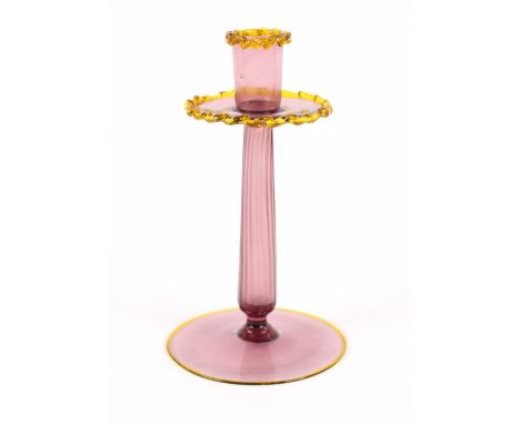 A Glas Fabrik of Karlsbad amethyst glass oval bowl; four matching posy vases; and a Venetian amethyst glass candlestick