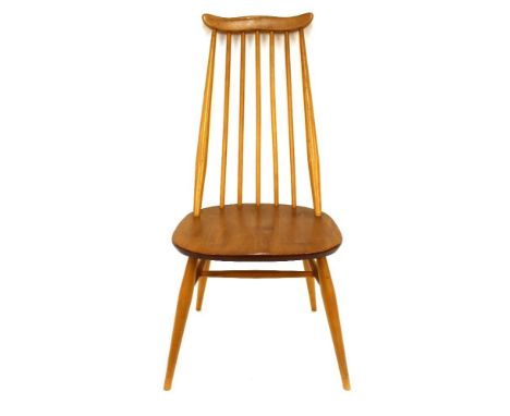 A set of eight light Ercol stick back dining chairs