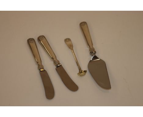 Tiffany & Co., two shell and thread butter spreaders; a cheese server; and a de Vermeil mustard ladle