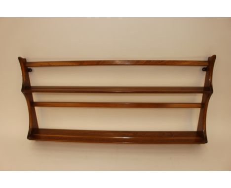 A light Ercol plate rack, 96cm