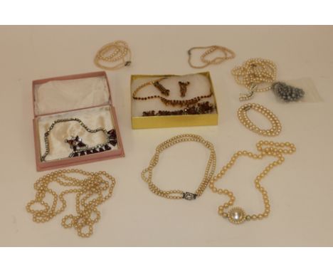 A quantity of various imitation pearl necklaces; a dress jewellery set comprising a bracelet, necklace and ear-rings set with