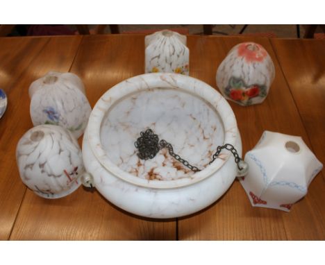 A large Art Deco mottled glass hanging ceiling light shade; and five various smaller decorated glass lamp shades 
