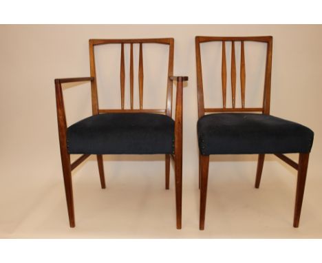 A set of six Danish teak stick back dining chairs