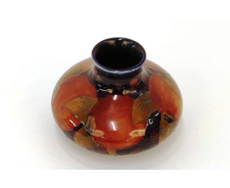 A Moorcroft "Pomegranate" pattern bulbous posy vase, 8cm high