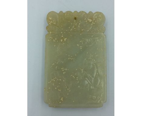 Chinese carved jade pendant depicting a child 