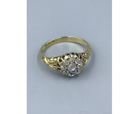 18ct gold &amp; diamond cluster ring, central old cushion cut diamond with a surround of 8 old cut diamonds to an open work s