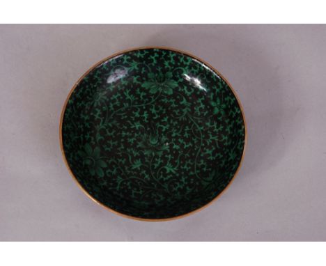Chinese black-ground green-glazed 'lotus scroll' dish, the exterior decorated with five bats in iron-red, Qianlong six-charac