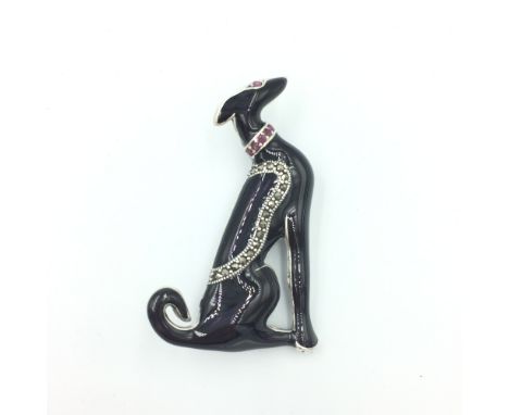 Silver enamel set brooch/pendant in the form of a greyhound with ruby collar 