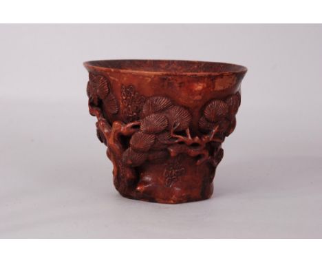 Chinese bamboo libation cup carved and pierced as a gnarled pine trunk with foliate branches, 11.2cm high 