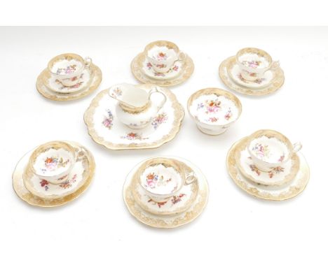 A 21-piece Hammersley &amp; Co, Longton, tea service, in pattern 265, featuring a floral design with a gilt lace trim, compri