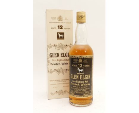 A bottle of Glen Elgin pure highland malt whisky, aged 12 years, 45% proof, 26 fl oz, boxed.Purchased by the vendor prior to 