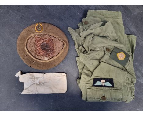 A WWII GHQ Indian Majors jungle jacket, with arm, breast and rank badges; together with Indian Army Medical Corps officers be