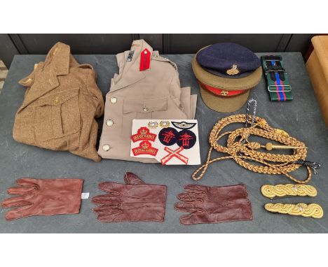 A group of Royal Marines uniform items, to include: a&nbsp;Brigadiers tropical tunic; a peaked cap; a beret; and other items.