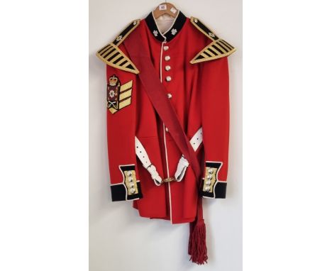 An Irish Guards Colour Sergeant Musician No.1 full dress scarlet tunic, with fine bullion insignia and tunic wings, buff leat