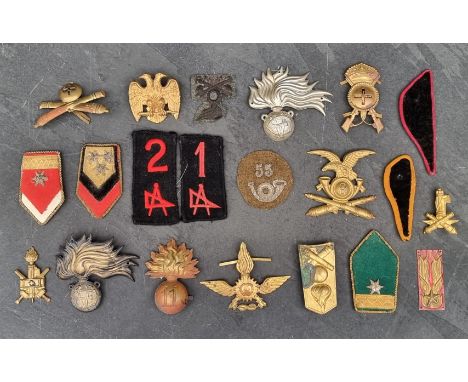A WWII era Italian badges, comprising: fascist, army, Air Force, and Carabinieri cap, collar and shoulder badges. (21)