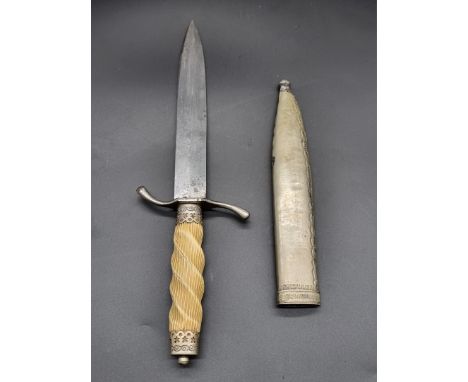 A dagger and sheath, the 14.5cm single edged blade stamped I P, with ivorine twist handle.