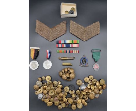 A group of military buttons and other items; to include: a pair of British army sergeant's stripes. 