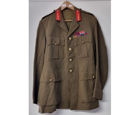 A WWII general army officers khaki whipcord service dress tunic, with medal tabs above breast pocket.