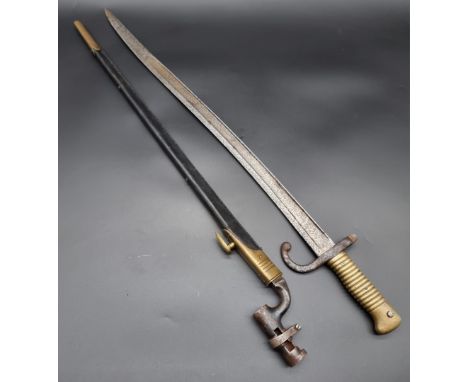 A British 1876 Pattern Martini Henry tri-form bayonet and scabbard, with 54cm blade; together with&nbsp;a French M1866 Chasse