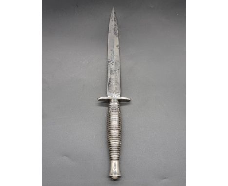 A Fairbairn Sykes 3rd pattern commando knife, by Wilkinson Sword, with 17cm blade.