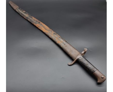 A British 1856 pattern yataghan sword bayonet and scabbard, for a Martini Henry rifle, stamped WD and broad arrow, with 58cm 