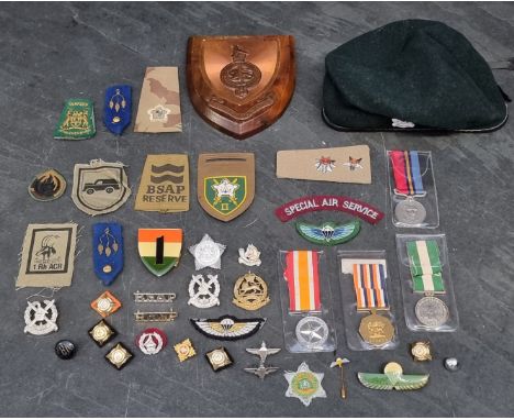 A Rhodesia Light Infantry and other ranks beret;&nbsp;together with&nbsp;a General Service Medal, to 662242 Pte G. Musvose; a