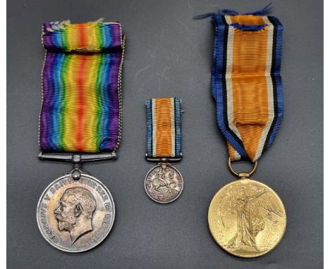 Medals:&nbsp;a WWI pair, to 202713 Pte R Griffiths Welsh Regt; together with a miniature War Medal. (3)
