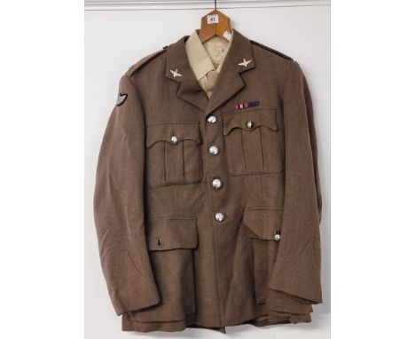 A circa 1963 officers service dress tunic, shirt and tie, with silver plated officer collar badges, SAS tunic buttons, and ju