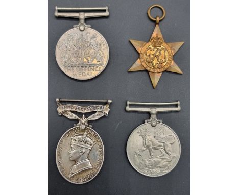 Medals: a George VI Territorial Efficiency Medal, to 1435306 S.Sjt R S Kemp R.E.M.E; together with three WWII medals, unoffic