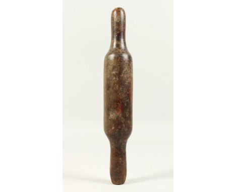 AN EARLY WOODEN ROLLING PIN. 29cms long.