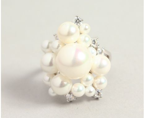 A SILVER BAROQUE PEARL RING.