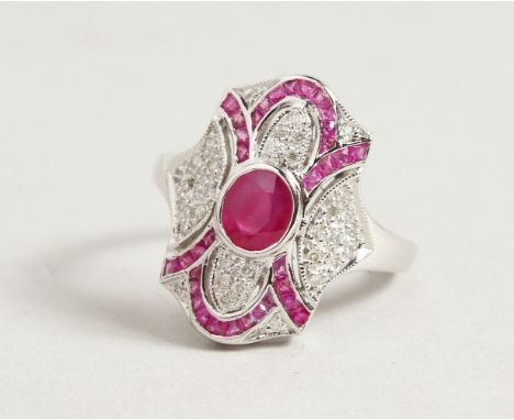 A 9CT GOLD ART DECO DESIGN RUBY AND DIAMOND RING.