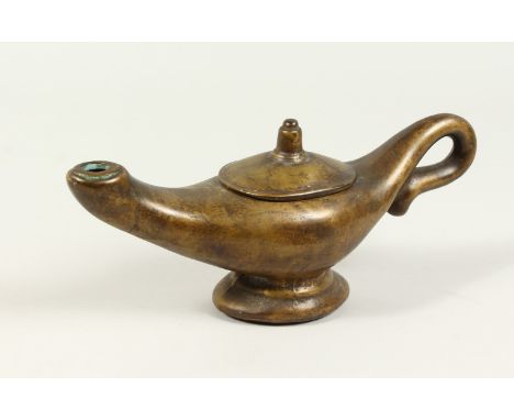 A BRONZE "ALADDINS LAMP" JUG. 28cms long.