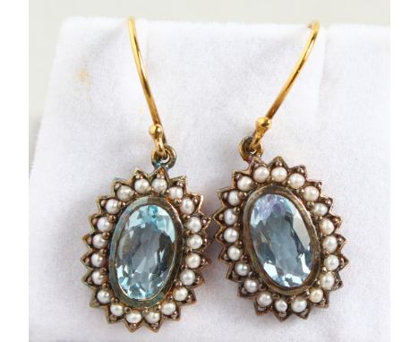 A PAIR OF 9CT GOLD AND SILVER, BLUE TOPAZ AND PEARL DROP EARRINGS.