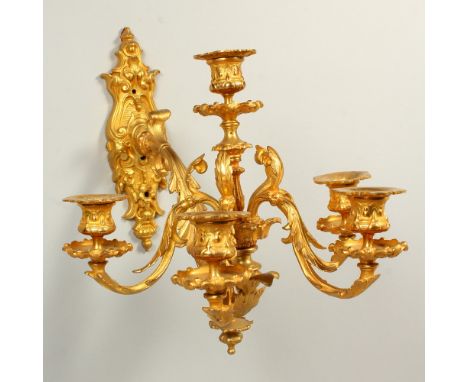 A GOOD SET OF SIX ROCOCO STYLE ORMOLU WALL LIGHT APPLIQUES, with cast backs, single arm supporting a four branch, five-light 
