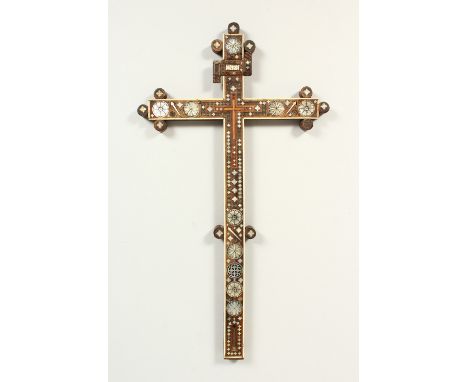 A SICILIAN CRUCIFIX, POSSIBLY 18TH CENTURY, carved wood with mother-of-pearl inlaid decoration. 37cms high.