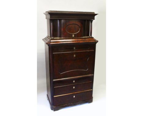 A 19TH CENTURY BEIDERMEIER MAHOGANY SECRETAIRE, the upper section with a moulded cornice over a bowfront door, above a frieze