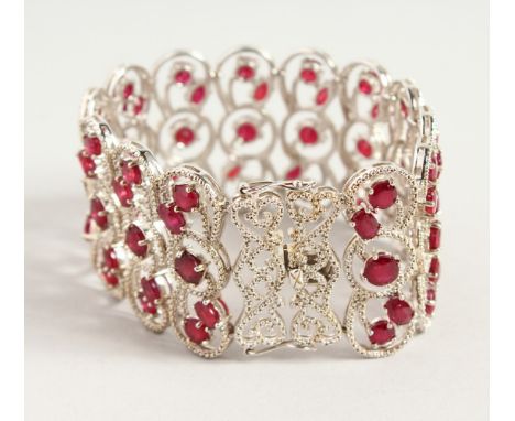 A VERY GOOD QUALITY SILVER AND RUBY WIDE BRACELET.